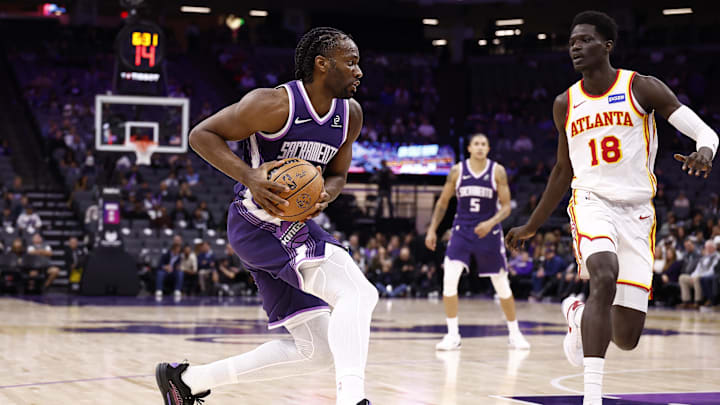 Nov 12, 2025; Sacramento, California, USA; Sacramento Kings forward Precious Achiuwa (9) drives in against Atlanta Hawks forward Mouhamed Gueye (18) during the fourth quarter at Golden 1 Center. Mandatory Credit: Kelley L Cox-Imagn Images