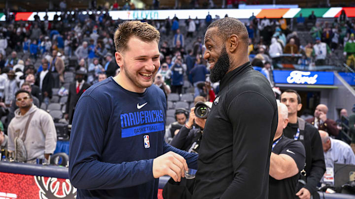 Luka Doncic (left) and LeBron James will be teammates on the Lakers after a blockbuster trade.