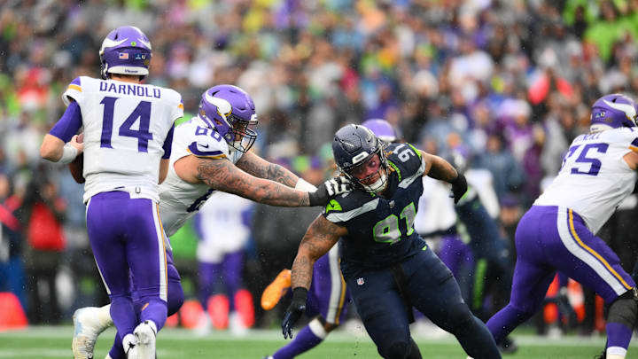 Dec 22, 2024; Seattle, Washington, USA; Minnesota Vikings guard Dalton Risner (66) blocks Seattle Seahawks defensive tackle Byron Murphy II (91) during the first half at Lumen Field. Mandatory Credit: Steven Bisig-Imagn Images