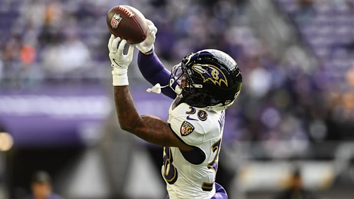 Nov 9, 2025; Minneapolis, Minnesota, USA; Baltimore Ravens cornerback Keyon Martin (38) warms up before the game against the Minnesota Vikings at U.S. Bank Stadium. Mandatory Credit: Jeffrey Becker-Imagn Images