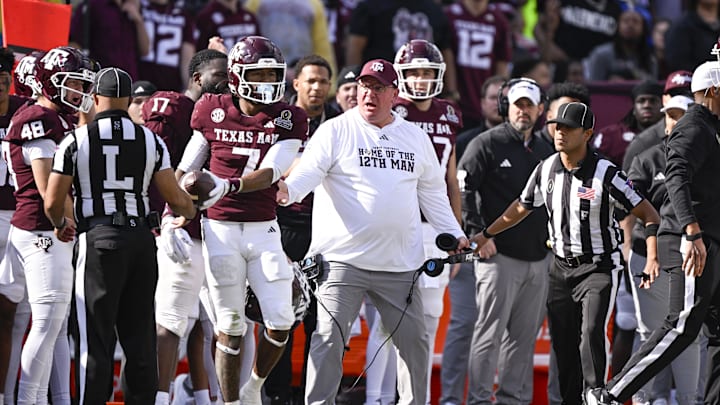 Dec 20, 2025; College Station, TX, USA; Texas A&M Aggies head coach Mike Elko reacts to a call during the game between the Aggies and the Hurricanes at Kyle Field. Mandatory Credit: Jerome Miron-Imagn Images