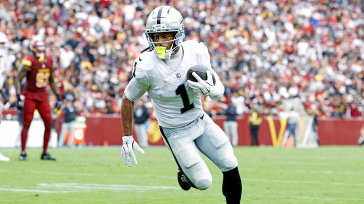 Sep 21, 2025; Landover, Maryland, USA; Las Vegas Raiders wide receiver Tre Tucker (1) runs a touchdown pass during the second half against the Washington Commanders at Northwest Stadium. Mandatory Credit: Amber Searls-Imagn Images Sep 21, 2025; Landover, Maryland, USA; Las Vegas Raiders wide receiver Tre Tucker (1) runs a touchdown pass during the second half against the Washington Commanders at Northwest Stadium. Mandatory Credit: Amber Searls-Imagn Images