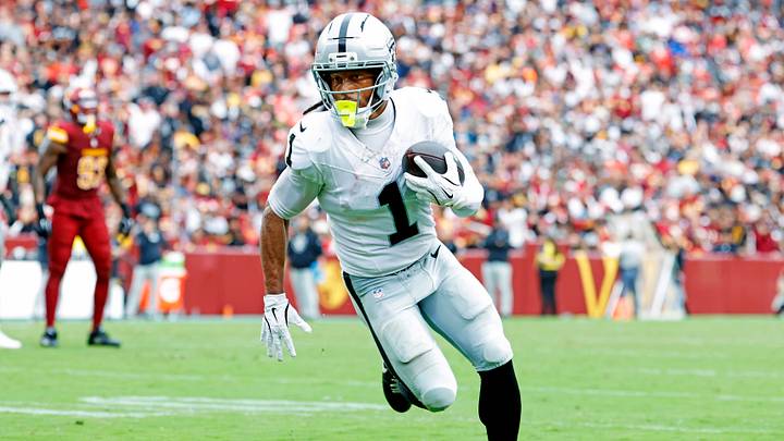 Las Vegas Raiders wide receiver Tre Tucker (1) runs a touchdown pass during the second half against the Washington Commanders at Northwest Stadium. Las Vegas Raiders wide receiver Tre Tucker (1) runs a touchdown pass during the second half against the Washington Commanders at Northwest Stadium.