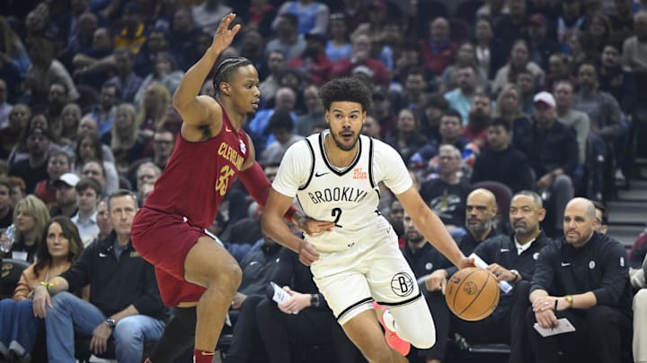 Mar 11, 2025; Cleveland, Ohio, USA; Cleveland Cavaliers forward Isaac Okoro (35) defends Brooklyn Nets forward Cameron Johnson (2) in the first quarter at Rocket Arena. Mandatory Credit: David Richard-Imagn Images