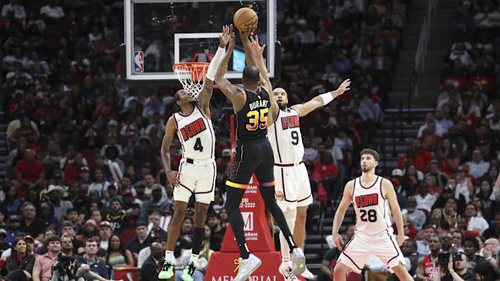 Mar 12, 2025; Houston, Texas, USA; Houston Rockets guard Jalen Green (4) and forward Dillon Brooks (9) defend against Phoenix Suns forward Kevin Durant (35) during the third quarter at Toyota Center. Mandatory Credit: Troy Taormina-Imagn Images Mar 12, 2025; Houston, Texas, USA; Houston Rockets guard Jalen Green (4) and forward Dillon Brooks (9) defend against Phoenix Suns forward Kevin Durant (35) during the third quarter at Toyota Center. Mandatory Credit: Troy Taormina-Imagn Images