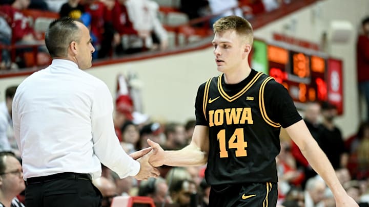 Jan 17, 2026; Bloomington, Indiana, USA; Iowa Hawkeyes guard Bennett Stirtz (14) greets Iowa Hawkeyes head coach Ben McCollum during the second half at Simon Skjodt Assembly Hall. Mandatory Credit: Robert Goddin-Imagn Images