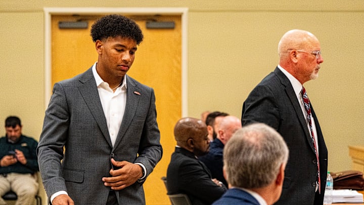 Ole Miss quarterback Trinidad Chambliss returns to his seat after testifying during the hearing in his lawsuit against the NCAA at Calhoun County Courthouse in Pittsboro, Miss., on Thursday, Feb. 12, 2026. Chambliss is looking for a temporary injunction and a permanent injunction against the NCAA for one more year of eligibility.