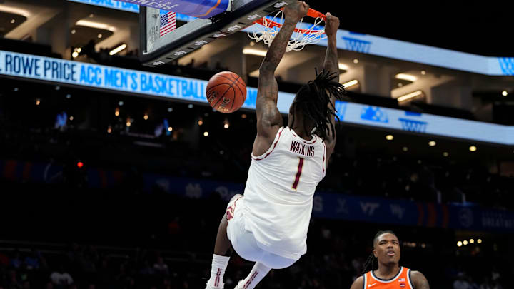 Mar 11, 2025; Charlotte, NC, USA; Florida State Seminoles guard Jamir Watkins (1) scores in the first half at Spectrum Center. Mandatory Credit: Bob Donnan-Imagn Images