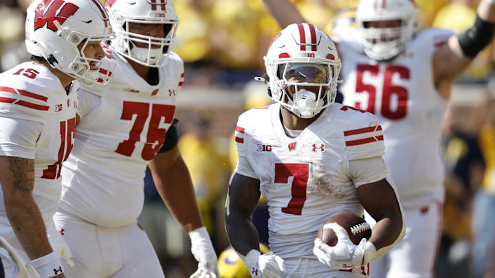 Oct 4, 2025; Ann Arbor, Michigan, USA;  Wisconsin Badgers running back Dilin Jones (7) celebrates after scoring in the first half against the Michigan Wolverines at Michigan Stadium. Mandatory Credit: Rick Osentoski-Imagn Images