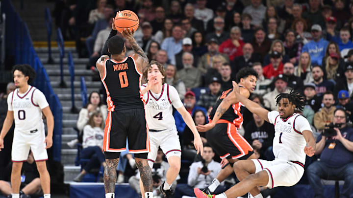 Jan 28, 2025; Spokane, Washington, USA; Oregon State Beavers guard Damarco Minor (0) shoots the ball against Gonzaga Bulldogs guard Michael Ajayi (1) in the second half at McCarthey Athletic Center. Mandatory Credit: James Snook-Imagn Images Jan 28, 2025; Spokane, Washington, USA; Oregon State Beavers guard Damarco Minor (0) shoots the ball against Gonzaga Bulldogs guard Michael Ajayi (1) in the second half at McCarthey Athletic Center. Mandatory Credit: James Snook-Imagn Images