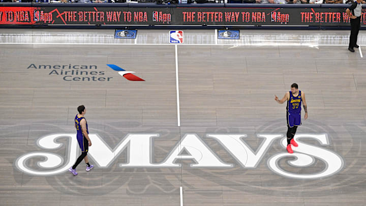 Apr 9, 2025; Dallas, Texas, USA; Los Angeles Lakers guard Luka Doncic (77) points to guard Austin Reaves (15) during the first quarter against the Dallas Mavericks at the American Airlines Center. Mandatory Credit: Jerome Miron-Imagn Images Apr 9, 2025; Dallas, Texas, USA; Los Angeles Lakers guard Luka Doncic (77) points to guard Austin Reaves (15) during the first quarter against the Dallas Mavericks at the American Airlines Center. Mandatory Credit: Jerome Miron-Imagn Images