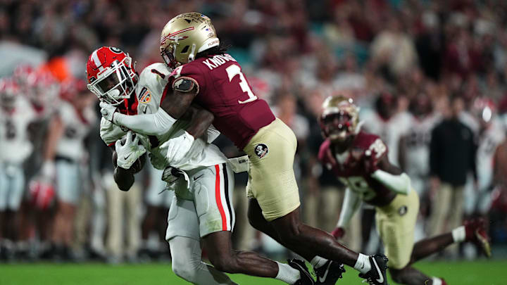 Dec 30, 2023; Miami Gardens, FL, USA; Georgia Bulldogs wide receiver Marcus Rosemy-Jacksaint (1) makes a catch against Florida State Seminoles defensive back Kevin Knowles II (3) during the second half in the 2023 Orange Bowl at Hard Rock Stadium. Mandatory Credit: Jasen Vinlove-USA TODAY Sports
