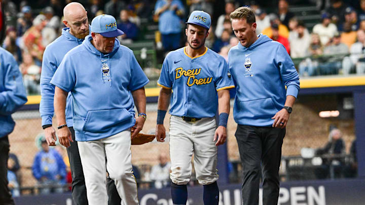 Sep 27, 2024; Milwaukee, Wisconsin, USA; Milwaukee Brewers right fielder Sal Frelick (10) walks off the field with an apparent injury after attempting to make a catch in the third inning against the New York Mets at American Family Field. Mandatory Credit: Benny Sieu-Imagn Images