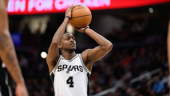 Feb 10, 2025; Washington, District of Columbia, USA; San Antonio Spurs guard De'Aaron Fox (4) shoots a free throw during the fourth quarter against the Washington Wizards at Capital One Arena. Mandatory Credit: Reggie Hildred-Imagn Images