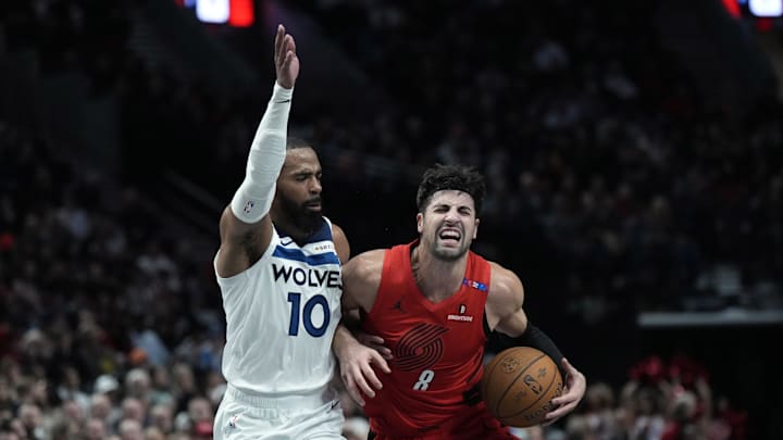 Portland Trail Blazers small forward Deni Avdija drives to the basket against Minnesota Timberwolves point guard Mike Conley (10) during the first half at Moda Center in Portland on Nov. 12, 2024.
