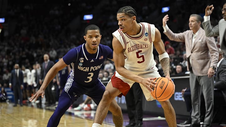 Mar 21, 2026; Portland, OR, USA; Arkansas Razorbacks guard Darius Acuff Jr. (5) drives against High Point Panthers guard Rob Martin (3) in the second half during a second round game of the men's 2026 NCAA Tournament at Moda Center. Mandatory Credit: Troy Wayrynen-Imagn Images