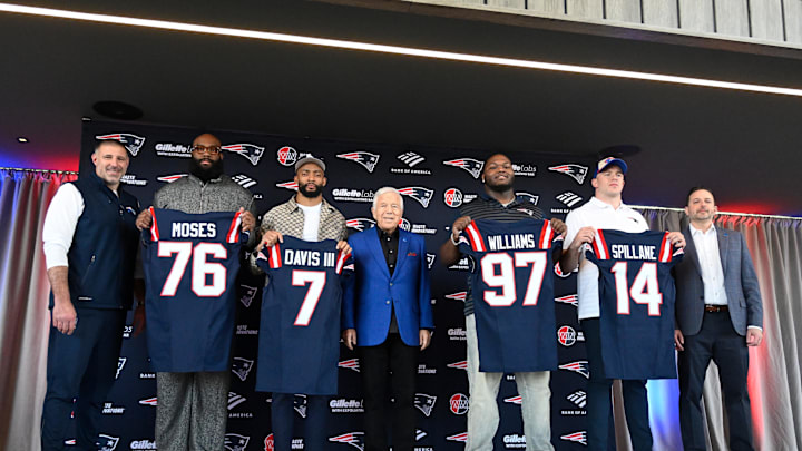 Mar 13, 2025; Foxborough, MA, USA; The New England Patriots hold a press conference at the GP Atrium at Gillette Stadium to introduce free agency additions to the team. (Left to right) New England Patriots head coach Mike Vrabel, offensive tackle Morgan Moses, cornerback Carlton Davis III, owner Robert Kraft, defensive tackle Milton Williams, linebacker Robert Spillane and executive vice president of player personnel Eliot Wolf. Mandatory Credit: Eric Canha-Imagn Images