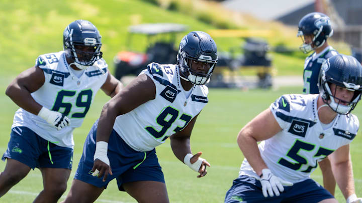 Jun 11, 2025; Renton, WA, USA; Seattle Seahawks defensive lineman Anthony Campbell (93) defensive lineman Bubba Thomas (69) and linebacker Connor O'Toole (57) take part in drills during mini-camp at Virginia Mason Athletic Center. Mandatory Credit: Stephen Brashear-Imagn Images