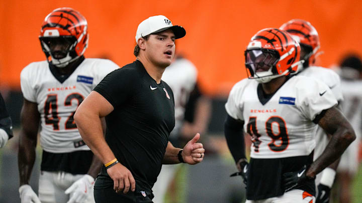 Cincinnati Bengals defensive end Trey Hendrickson (91) assists with a drill during a preseason training camp practice in downtown Cincinnati on Thursday, July 31, 2025.