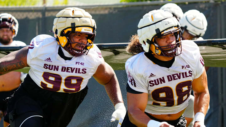 Arizona State defensive linemen CJ Fite (99) and Jacob Rich Kongaika (98) run a drill during the first day of fall practice in Tempe, Ariz. on July 30, 2025. Arizona State defensive linemen CJ Fite (99) and Jacob Rich Kongaika (98) run a drill during the first day of fall practice in Tempe, Ariz. on July 30, 2025.