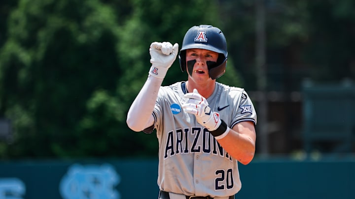 Jun 8, 2025; Chapel Hill, NC, USA; Arizona catcher Tommy Splaine (20) celebrates being on base during the first inning of the Super Regionals game against North Carolina in Chapel Hill, North Carolina. Mandatory Credit: Jaylynn Nash-Imagn Images Jun 8, 2025; Chapel Hill, NC, USA; Arizona catcher Tommy Splaine (20) celebrates being on base during the first inning of the Super Regionals game against North Carolina in Chapel Hill, North Carolina. Mandatory Credit: Jaylynn Nash-Imagn Images