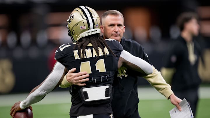 Dec 1, 2024; New Orleans, Louisiana, USA; New Orleans Saints interim head coach Darren Rizzi greets New Orleans Saints running back Alvin Kamara (41) before a game against the Los Angeles Rams at Caesars Superdome. Mandatory Credit: Matthew Hinton-Imagn Images Dec 1, 2024; New Orleans, Louisiana, USA; New Orleans Saints interim head coach Darren Rizzi greets New Orleans Saints running back Alvin Kamara (41) before a game against the Los Angeles Rams at Caesars Superdome. Mandatory Credit: Matthew Hinton-Imagn Images