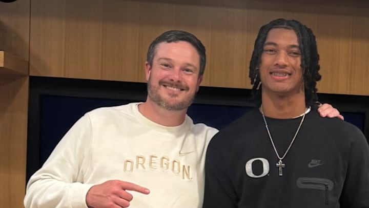 Chris Henry Jr. with Oregon coach Dan Lanning