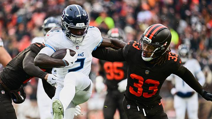 Tennessee Titans running back Tyjae Spears runs with the ball against Cleveland Browns safety Ronnie Hickman.