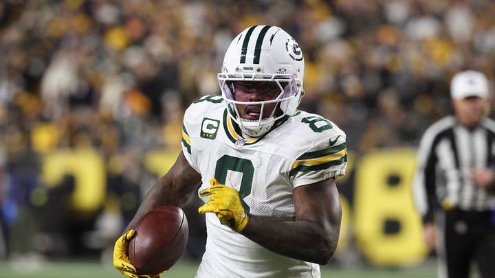 Green Bay Packers running back Josh Jacobs (8) runs the ball Green Bay Packers running back Josh Jacobs (8) runs the ball