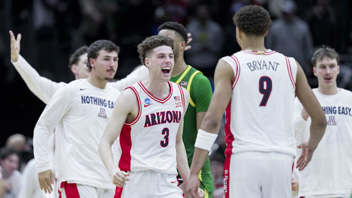 Mar 23, 2025; Seattle, WA, USA;  Arizona Wildcats guard Anthony Dell'Orso (3) celebrates with forward Carter Bryant (9) after defeating the Oregon Ducks at Climate Pledge Arena. Mandatory Credit: Stephen Brashear-Imagn Images