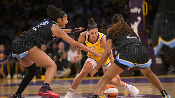 Jun 29, 2025; Los Angeles, California, USA; Los Angeles Sparks guard Kelsey Plum (10) is double teamed by Chicago Sky forward Angel Reese (5) and guard Ariel Atkins (7) in the first half at Crypto.com Arena. Mandatory Credit: Jayne Kamin-Oncea-Imagn Images