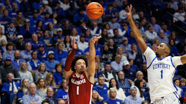 Jan 18, 2025; Lexington, Kentucky, USA; Alabama Crimson Tide guard Mark Sears (1) shoots the ball against Kentucky Wildcats guard Lamont Butler (1) during the first half at Rupp Arena at Central Bank Center. Mandatory Credit: Jordan Prather-Imagn Images