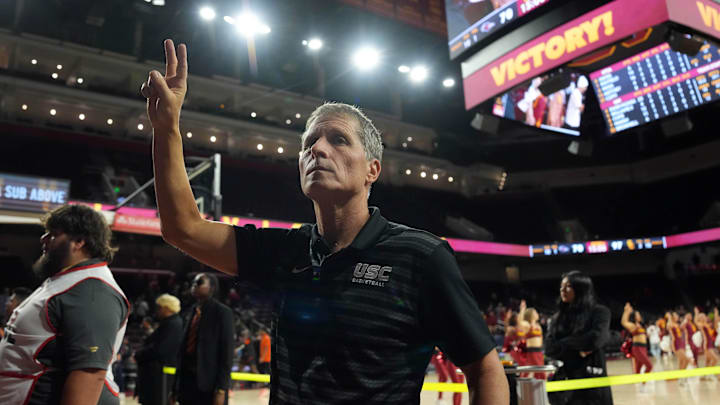 Dec 17, 2025; Los Angeles, California, USA; Southern California Trojans head coach Eric Musselman holds up Fight On sign after victory against the UTSA Roadrunners at the Galen Center. Mandatory Credit: Kirby Lee-Imagn Images