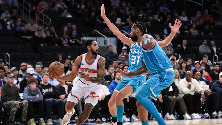 Oct 15, 2024; New York, New York, USA; New York Knicks guard Cameron Payne (1) looks to pass the ball while being defended by Charlotte Hornets forward Tidjane Salaun (31) and center Nick Richards (4) during the first half at Madison Square Garden. Mandatory Credit: John Jones-Imagn Images Oct 15, 2024; New York, New York, USA; New York Knicks guard Cameron Payne (1) looks to pass the ball while being defended by Charlotte Hornets forward Tidjane Salaun (31) and center Nick Richards (4) during the first half at Madison Square Garden. Mandatory Credit: John Jones-Imagn Images