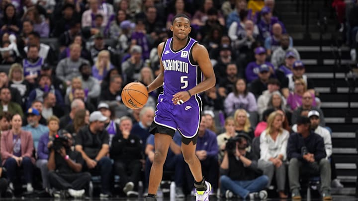 Nov 24, 2024; Sacramento, California, USA; Sacramento Kings guard De'Aaron Fox (5) dribbles against the Brooklyn Nets during the fourth quarter at Golden 1 Center. Mandatory Credit: Darren Yamashita-Imagn Images