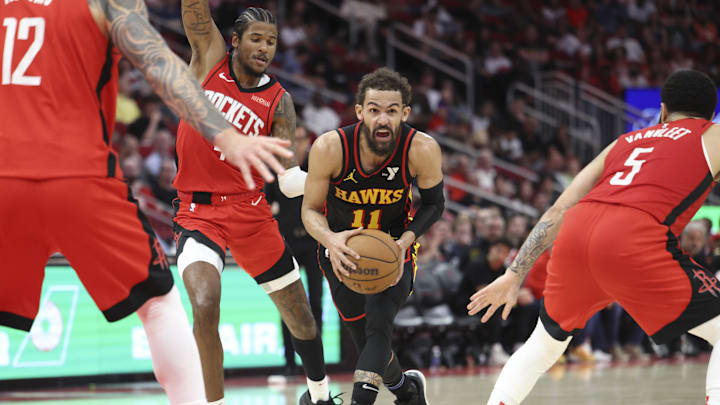 Mar 25, 2025; Houston, Texas, USA; Atlanta Hawks guard Trae Young (11) drives with the ball during the fourth quarter against the Houston Rockets at Toyota Center. Mandatory Credit: Troy Taormina-Imagn Images