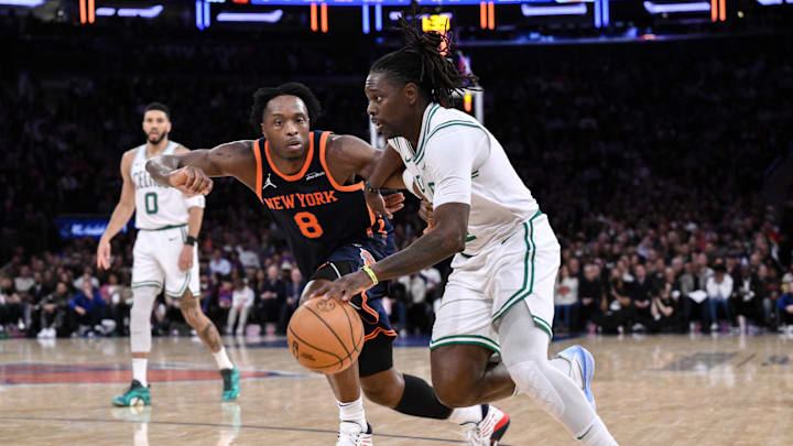 Boston Celtics guard Jrue Holiday drives past New York Knicks forward OG Anunoby.