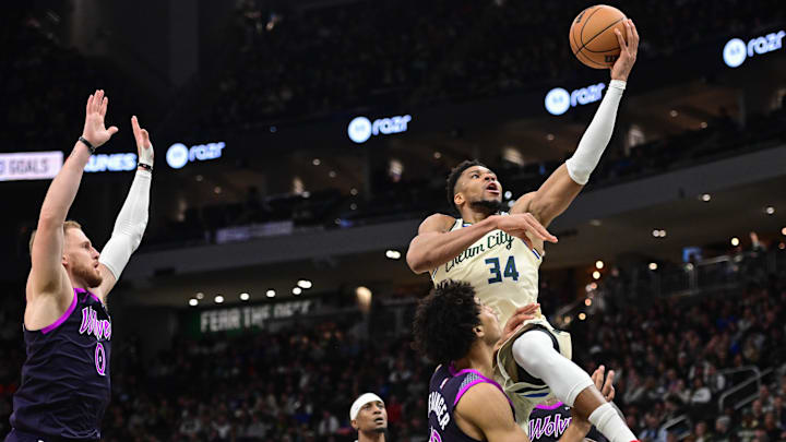 Jan 13, 2026; Milwaukee, Wisconsin, USA; Milwaukee Bucks forward Giannis Antetokounmpo (34) takes a shot against Minnesota Timberwolves center Joan Beringer (19) in the third quarter at Fiserv Forum. Mandatory Credit: Benny Sieu-Imagn Images