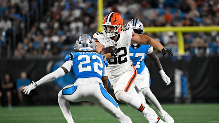 Aug 8, 2025; Charlotte, North Carolina, USA;  Cleveland Browns tight end Brenden Bates (82) with the ball as Carolina Panthers safety Lathan Ransom (22) and linebacker Bam Martin-Scott (57) defend in the third quarter at Bank of America Stadium. Mandatory Credit: Bob Donnan-Imagn Images