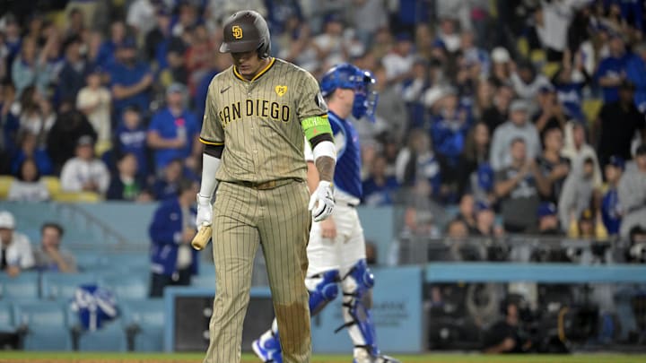 Sep 26, 2024; Los Angeles, California, USA; San Diego Padres third baseman Manny Machado (13) walks back to the dugout after striking out in the eighth inning against the Los Angeles Dodgers at Dodger Stadium. Mandatory Credit: Jayne Kamin-Oncea-Imagn Images