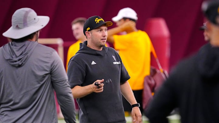 Arizona State head coach Kenny Dillingham talks with assistant coaches during a practice at the Verde Dickey Dome in Tempe on Aug. 19, 2025. Arizona State head coach Kenny Dillingham talks with assistant coaches during a practice at the Verde Dickey Dome in Tempe on Aug. 19, 2025.