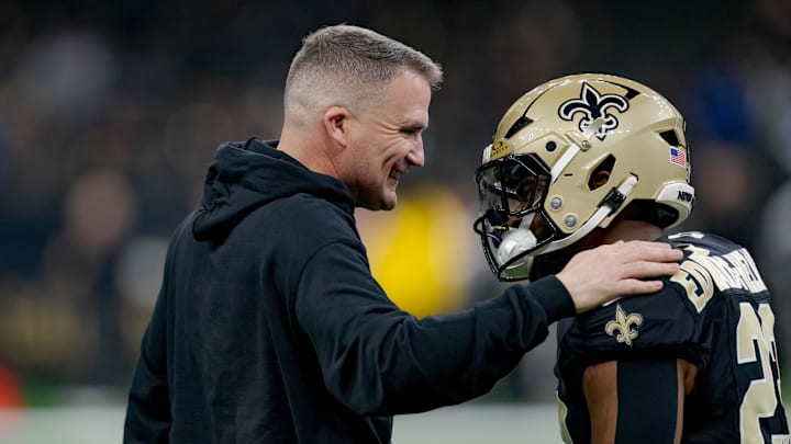 Dec 29, 2024; New Orleans, Louisiana, USA; New Orleans Saints interim head coach Darren Rizzi greets New Orleans Saints running back Clyde Edwards-Helaire (23) before a game against the Las Vegas Raiders at Caesars Superdome. Mandatory Credit: Matthew Hinton-Imagn Images