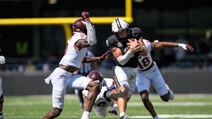 Aug 31, 2024; Nashville, Tennessee, USA;  Vanderbilt Commodores quarterback Diego Pavia (2) runs the ball against the Virginia Tech Hokies during the second half at FirstBank Stadium. Mandatory Credit: Steve Roberts-Imagn Images