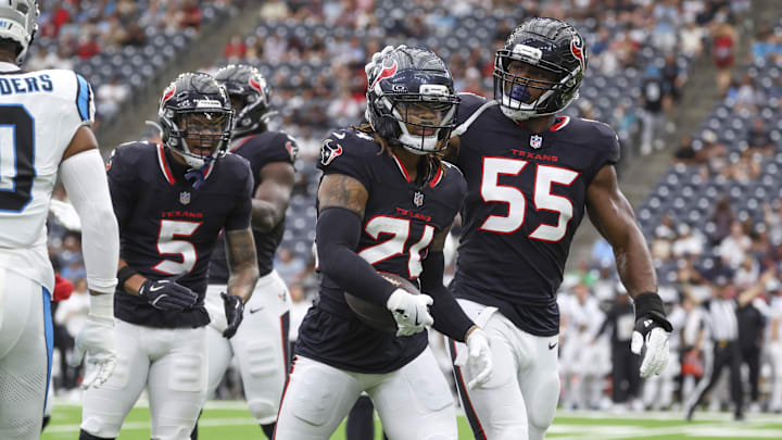 Aug 16, 2025; Houston, Texas, USA; Houston Texans cornerback Derek Stingley Jr. (24) is congratulated by defensive end Danielle Hunter (55) after a play during the first quarter against the Carolina Panthers at NRG Stadium. Mandatory Credit: Troy Taormina-Imagn Images