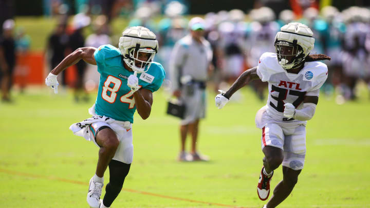 Miami Dolphins wide receiver Anthony Schwartz (84) runs against Atlanta Falcons cornerback Harrison Hand (37) during a joint practice at Baptist Health Training Complex. Miami Dolphins wide receiver Anthony Schwartz (84) runs against Atlanta Falcons cornerback Harrison Hand (37) during a joint practice at Baptist Health Training Complex.