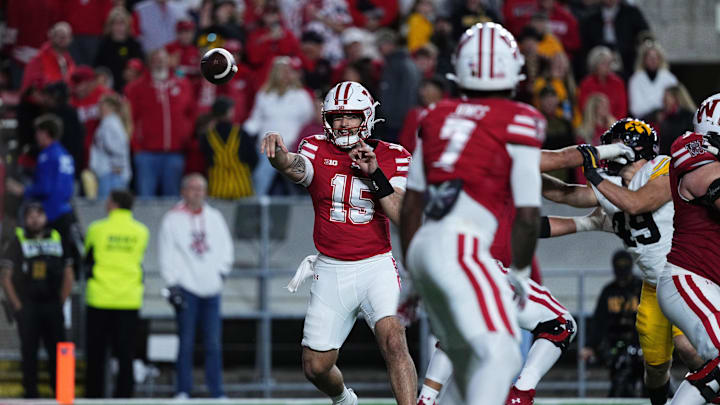Oct 11, 2025; Madison, Wisconsin, USA; Wisconsin Badgers quarterback Hunter Simmons (15) attempts a pass in the second half against the Iowa Hawkeyes at Camp Randall Stadium. Mandatory Credit: Ross Harried-Imagn Images Oct 11, 2025; Madison, Wisconsin, USA; Wisconsin Badgers quarterback Hunter Simmons (15) attempts a pass in the second half against the Iowa Hawkeyes at Camp Randall Stadium. Mandatory Credit: Ross Harried-Imagn Images