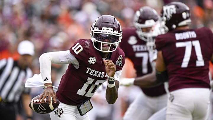 Dec 20, 2025; College Station, TX, USA; Texas A&M Aggies quarterback Marcel Reed (10) runs with the ball during the game between the Aggies and the Hurricanes at Kyle Field. Mandatory Credit: Jerome Miron-Imagn Images