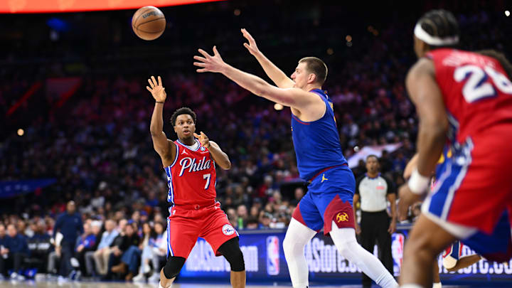 Jan 31, 2025; Philadelphia, Pennsylvania, USA; Philadelphia 76ers guard Kyle Lowry (7) passes the ball against Denver Nuggets center Nikola Jokic (15) in the third quarter at Wells Fargo Center. Mandatory Credit: Kyle Ross-Imagn Images Jan 31, 2025; Philadelphia, Pennsylvania, USA; Philadelphia 76ers guard Kyle Lowry (7) passes the ball against Denver Nuggets center Nikola Jokic (15) in the third quarter at Wells Fargo Center. Mandatory Credit: Kyle Ross-Imagn Images