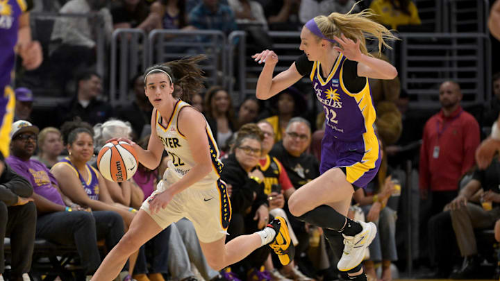 May 24, 2024; Los Angeles, California, USA;  Indiana Fever guard Caitlin Clark (22) Los Angeles Sparks forward Cameron Brink (22) in the first half at Crypto.com Arena. Mandatory Credit: Jayne Kamin-Oncea-Imagn Images