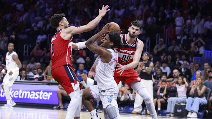Apr 13, 2025; Miami, Florida, USA; Washington Wizards guard Colby Jones (1) and forward Tristan Vukcevic (00) defend Miami Heat guard Josh Christopher (8) during the second half at Kaseya Center. Mandatory Credit: Rhona Wise-Imagn Images Apr 13, 2025; Miami, Florida, USA; Washington Wizards guard Colby Jones (1) and forward Tristan Vukcevic (00) defend Miami Heat guard Josh Christopher (8) during the second half at Kaseya Center. Mandatory Credit: Rhona Wise-Imagn Images